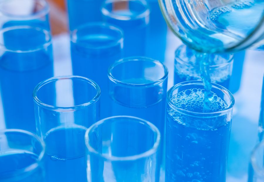Well water samples being prepared in test tubes for laboratory analysis